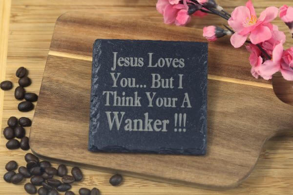 Jesus loves you but I think your a w***er Slate Coaster